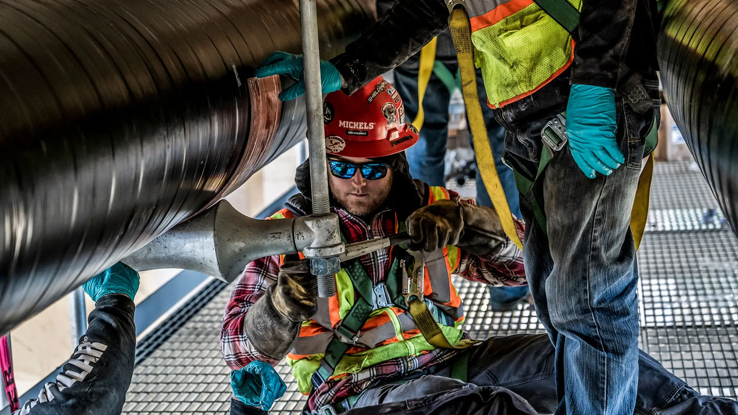 Morgan Luis Utility Services crew fastens natural gas pipelines under bridge in Minneapolis Minnesota