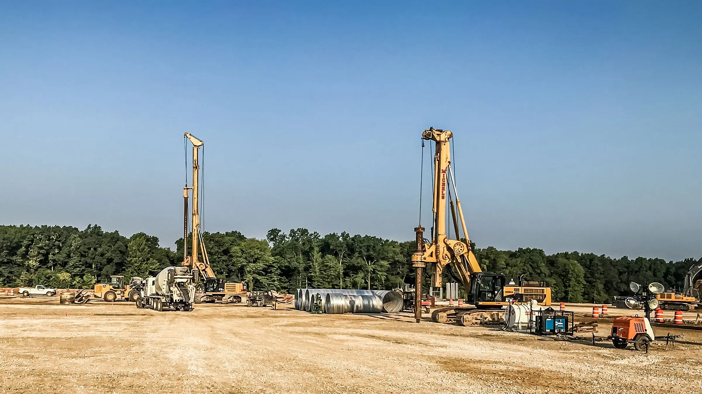 Borehole is drilled into the ground to prepare for caissons