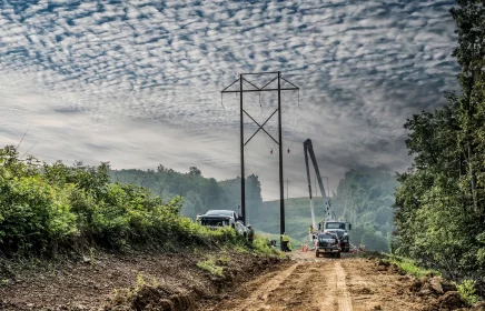Power crew works on power lines in remote area