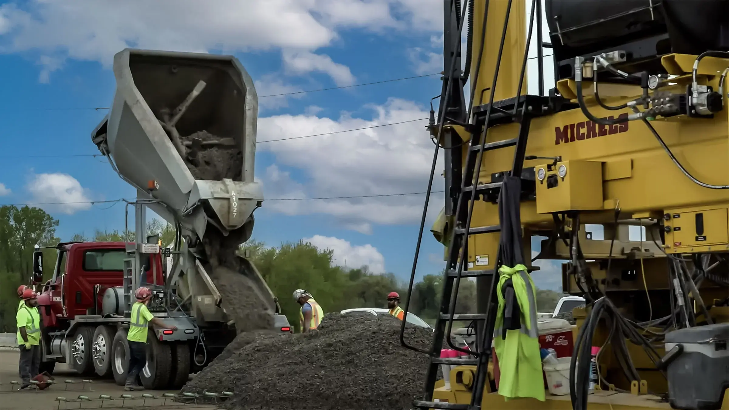Aggregates being poured by a Michels dump truck.