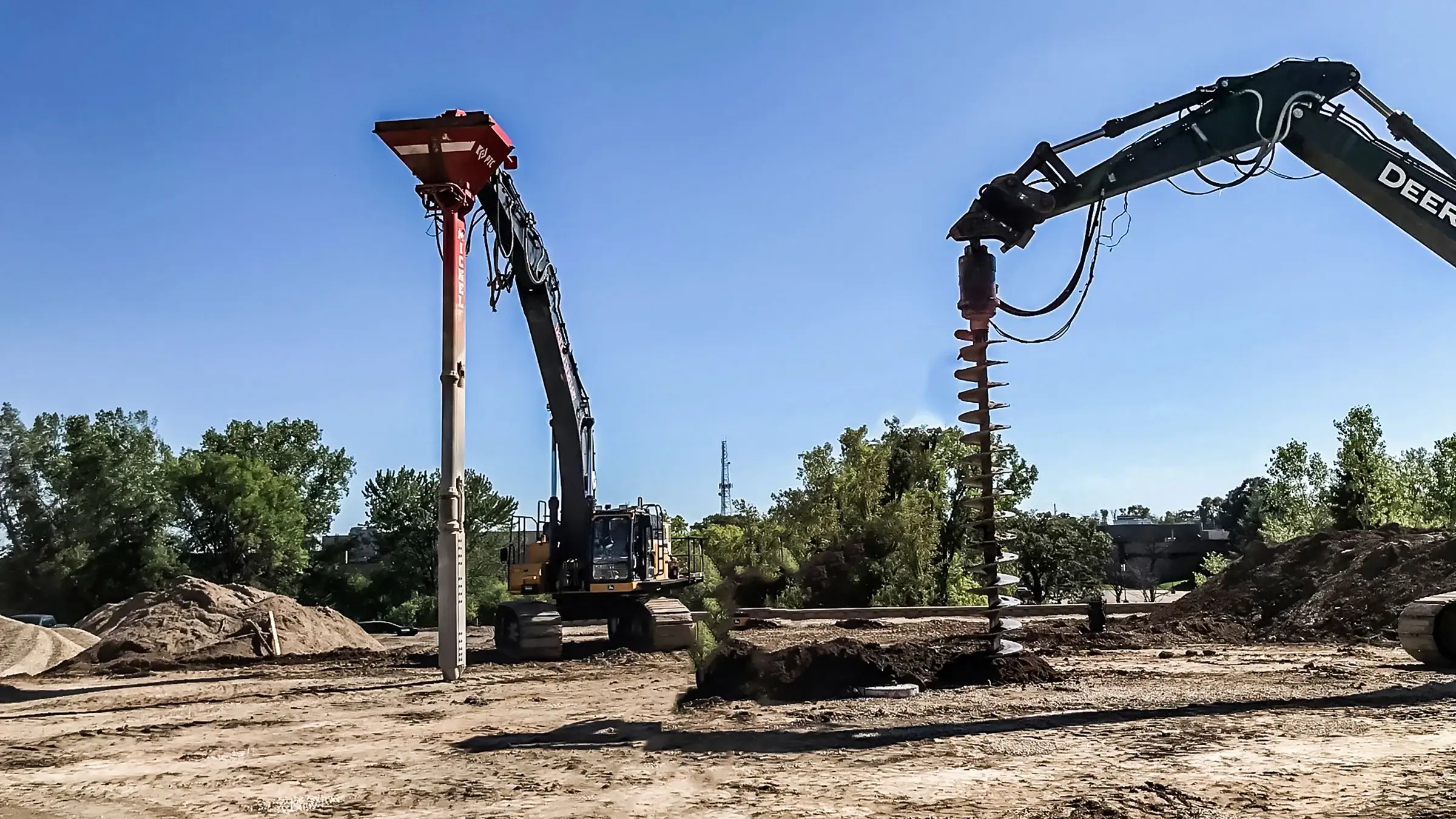 Drilling machines working in an open area.