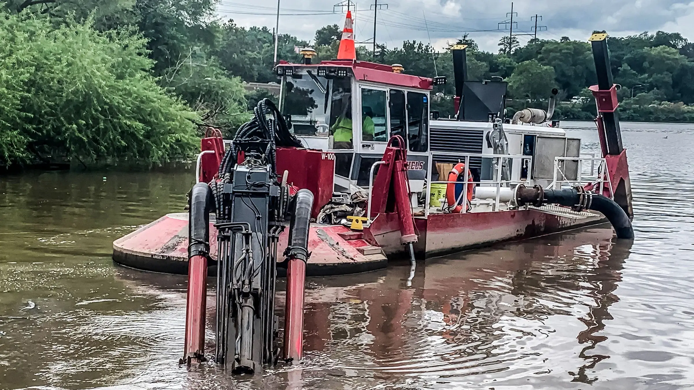 A dredging machine operates on a river