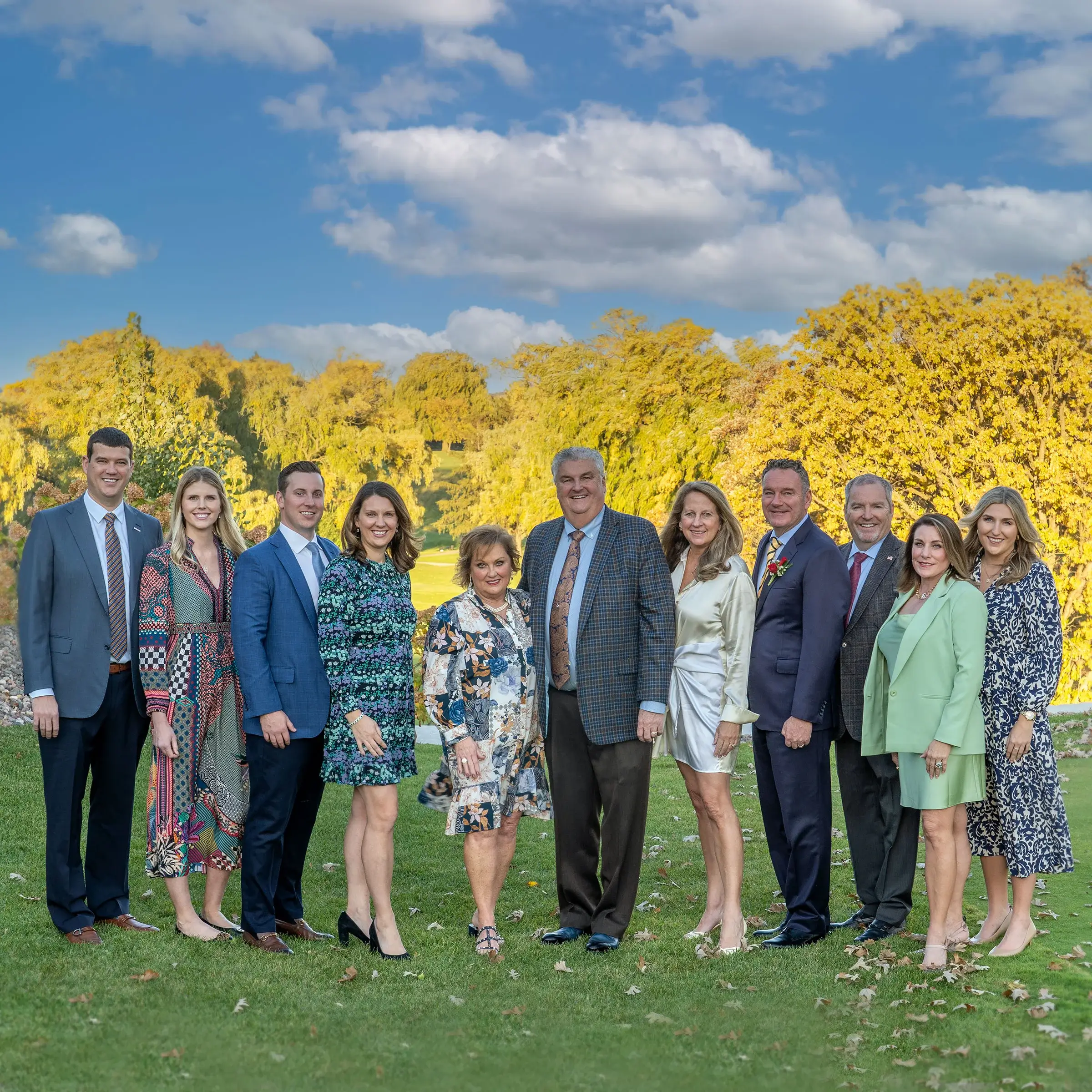 Michels Family stands together outside of a country club at a 25th anniversary event