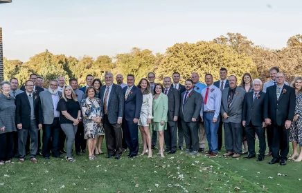 Employees who have been with the company for 25 years join with the Michels family for a celebratory dinner