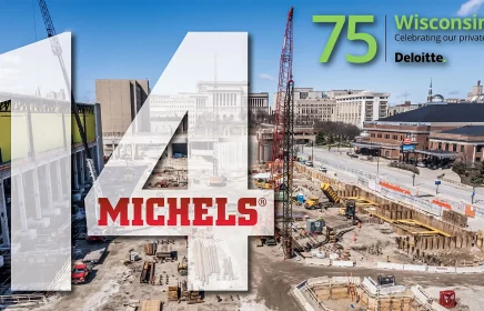 Aerial photo of jobsite in a city on a day with bright blue sky