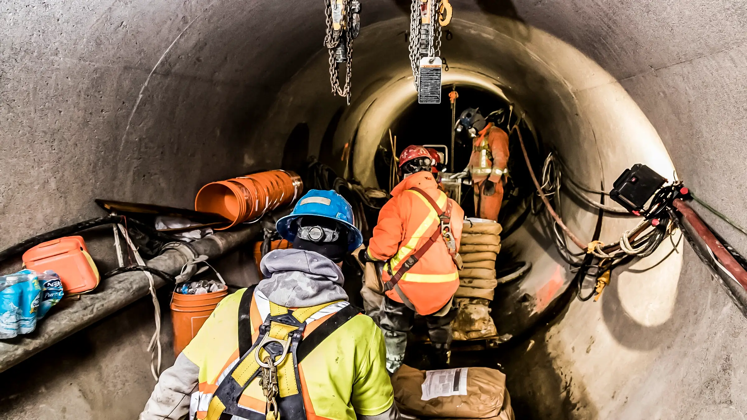 A Michels Canada crew sprays geopolymer mortar inside a water main to rehabilitate it