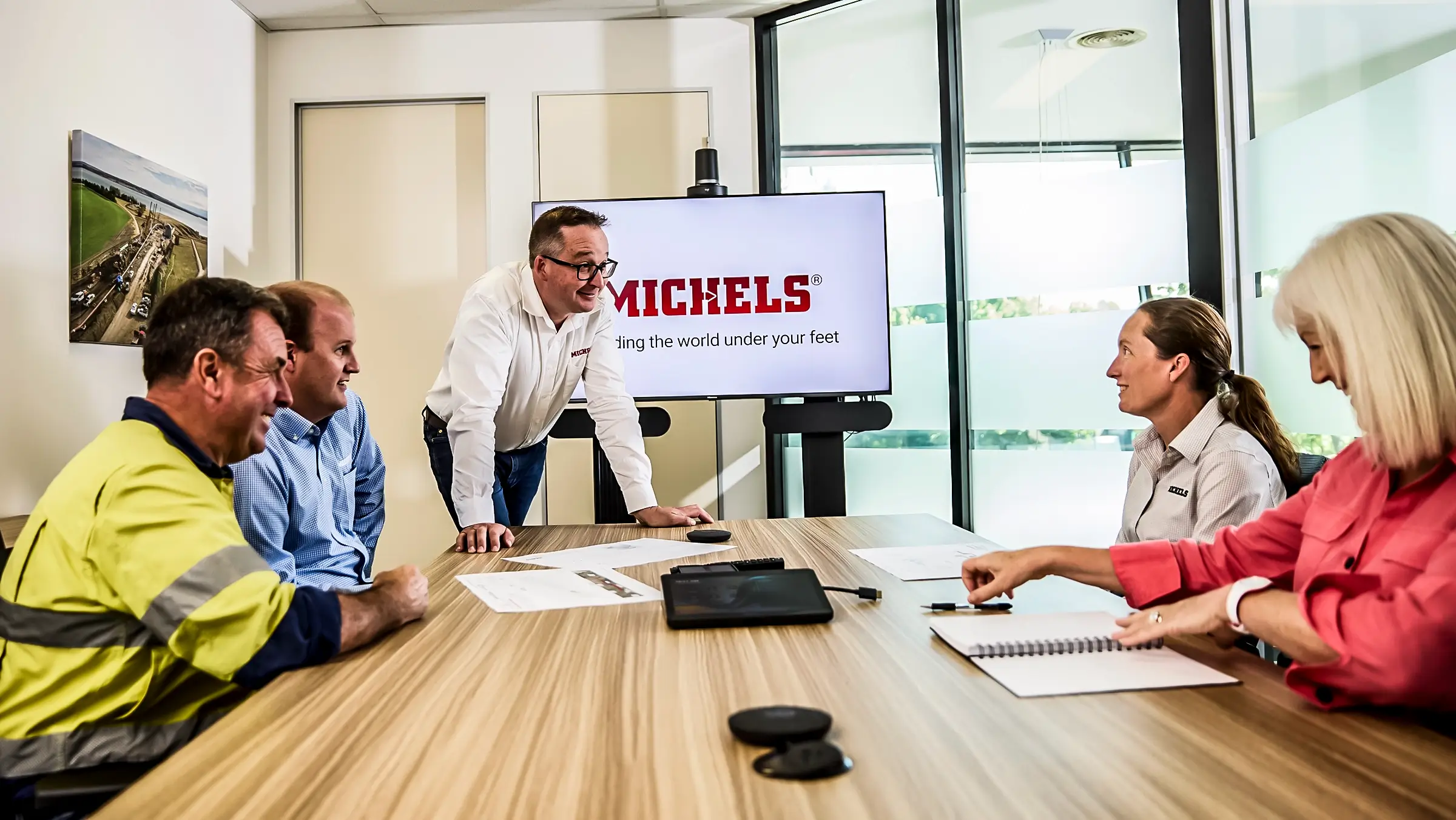 Group of employees around a meeting table.