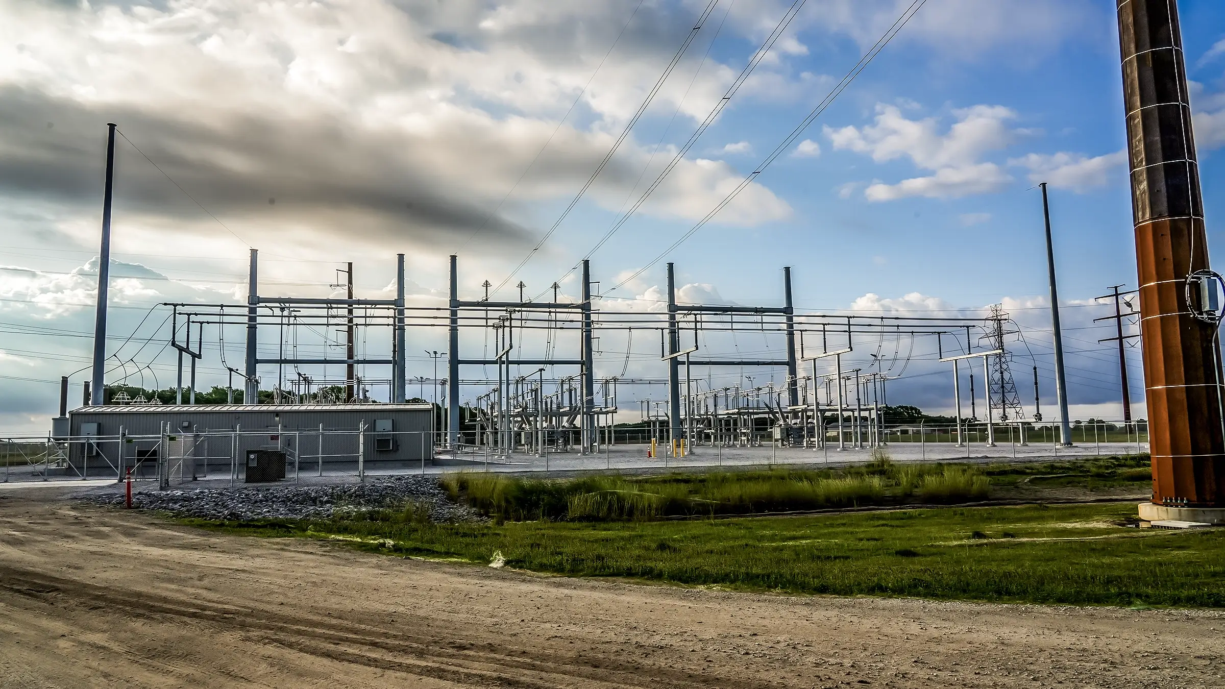 A switchyard on a slightly overcast summer day.